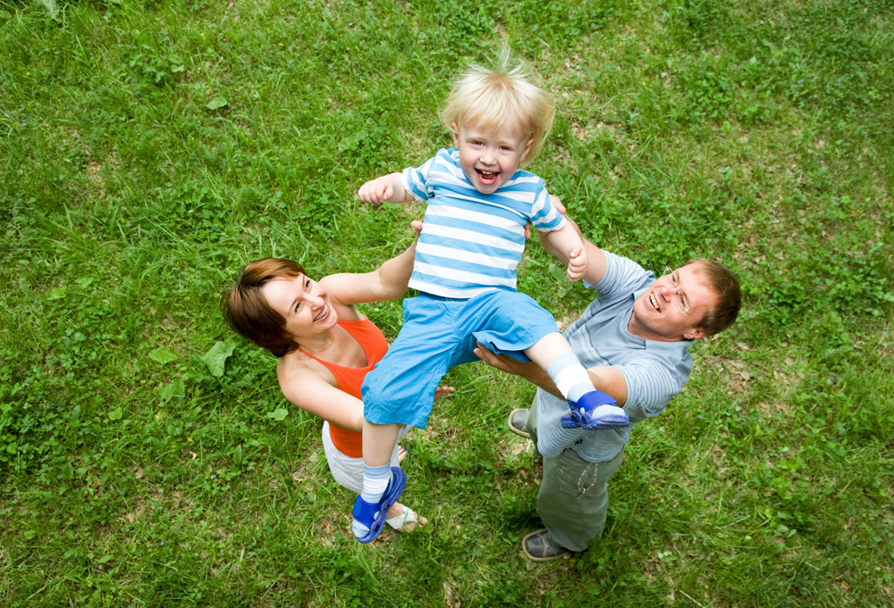 Family playing outside after their chiropractic appointments.